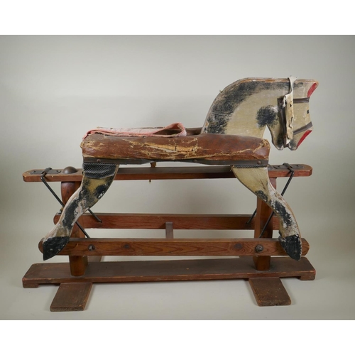 207 - An antique painted pine rocking horse, 82cm long, 56cm high