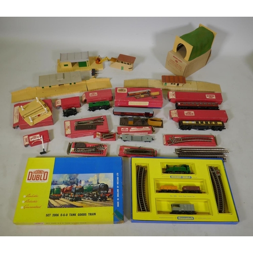 212 - A collection of Hornby Dublo 00 gauge rolling stock, scenery buildings and track, most in original b... 