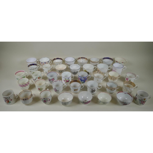 213 - A collection of English C18th and C19th porcelain tea cups and coffee cans, many with hand painted d... 