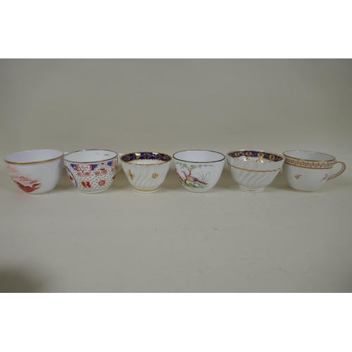 213 - A collection of English C18th and C19th porcelain tea cups and coffee cans, many with hand painted d... 