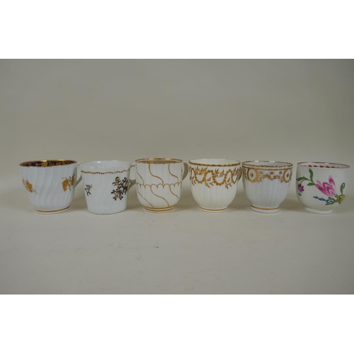 213 - A collection of English C18th and C19th porcelain tea cups and coffee cans, many with hand painted d... 