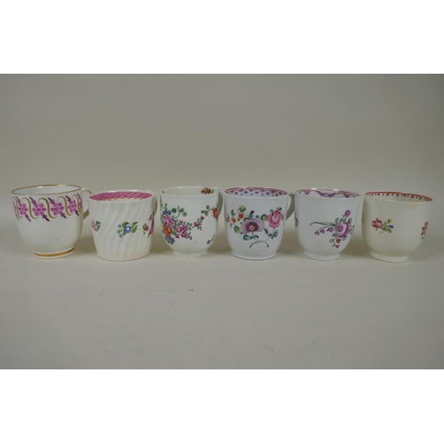 213 - A collection of English C18th and C19th porcelain tea cups and coffee cans, many with hand painted d... 