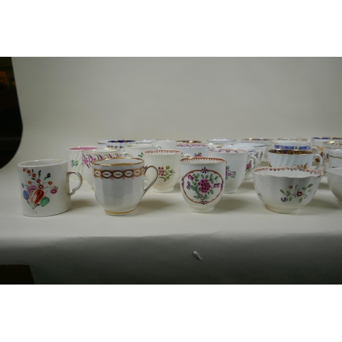 213 - A collection of English C18th and C19th porcelain tea cups and coffee cans, many with hand painted d... 