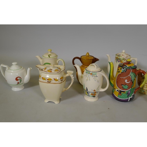 214 - A collection of vintage pottery coffee pots, Doulton, Watcomb, Burleigh etc