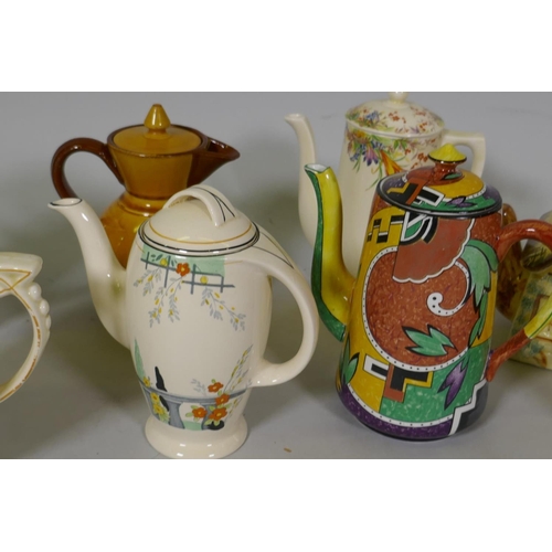 214 - A collection of vintage pottery coffee pots, Doulton, Watcomb, Burleigh etc