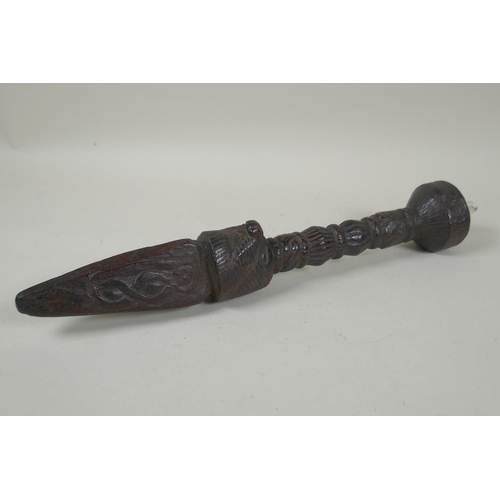 223 - A Tibetan carved hardwood ceremonial phurba, set with a crystal cabouchon, 35cm