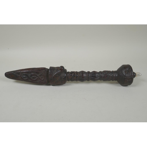 223 - A Tibetan carved hardwood ceremonial phurba, set with a crystal cabouchon, 35cm