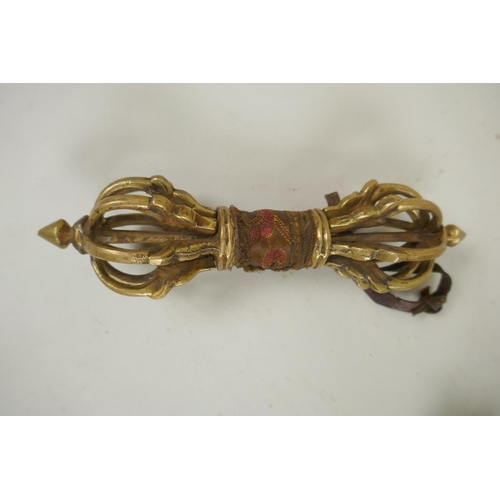 225 - A Tibetan bronze handled ceremonial kartika, and a bronze vajra, 17cm longest