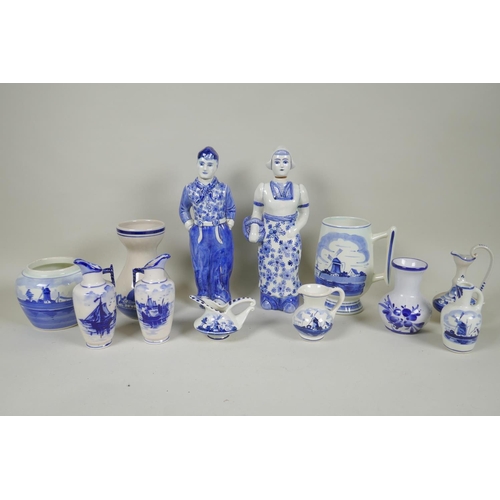 227 - A quantity of assorted Delft blue and white porcelain, to include figural decanters/bottles, vases, ... 