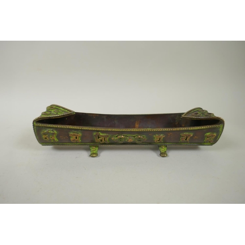 253 - A Tibetan brass scroll case with inscription decoration, together with a bronze incense holder with ... 