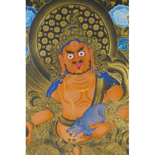 255 - A Tibetan painted thangka depicting Jambhala, in a silk mount, 82 x 126cm