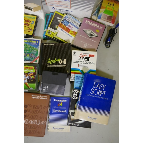 26 - Two Commodore 64, accessories, floppy disk readers, programs and games to include Ghostbusters, Supe... 