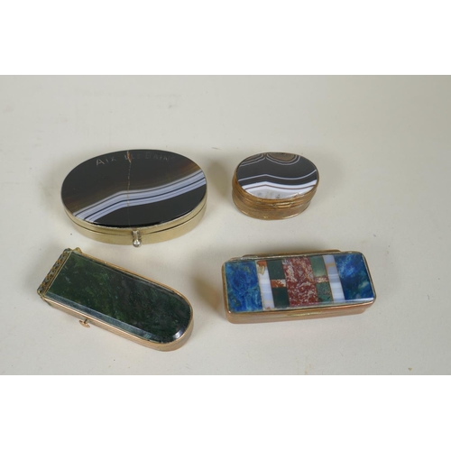 27 - An antique brass snuff box with specimen stone set lid and jasper set base, together with a brass an... 