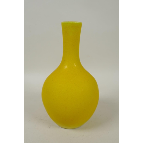 273 - A Chinese yellow ground porcelain bottle vase, KangXi 4 character mark to base, 17cm high