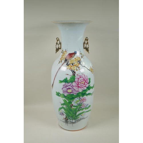 278 - A Chinese polychrome porcelain two handled vase decorated with a bird amongst flowers, character ins... 