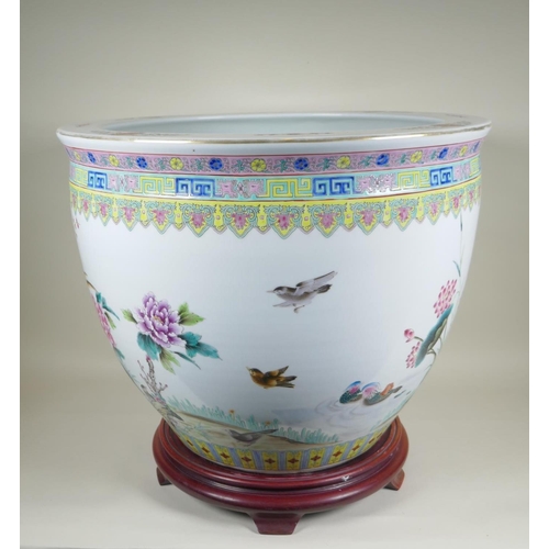 28 - A Chinese famille rose porcelain fish bowl, with enamel decoration of birds, flowers and auspicious ... 