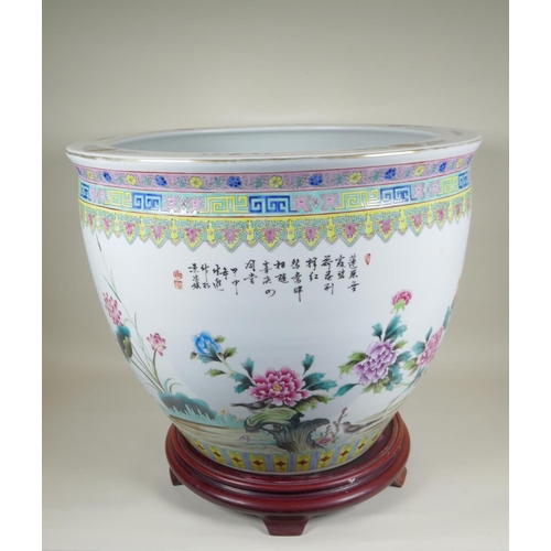 28 - A Chinese famille rose porcelain fish bowl, with enamel decoration of birds, flowers and auspicious ... 