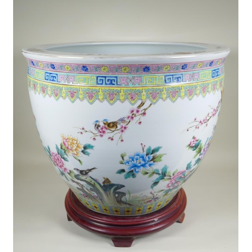 28 - A Chinese famille rose porcelain fish bowl, with enamel decoration of birds, flowers and auspicious ... 