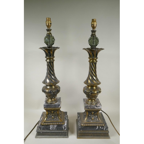 284 - A pair of gilt metal and marble table lamps, with a twisted column, 70cm high