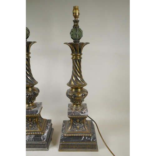 284 - A pair of gilt metal and marble table lamps, with a twisted column, 70cm high