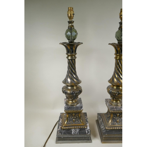 284 - A pair of gilt metal and marble table lamps, with a twisted column, 70cm high