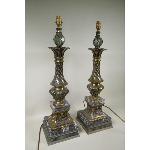 284 - A pair of gilt metal and marble table lamps, with a twisted column, 70cm high