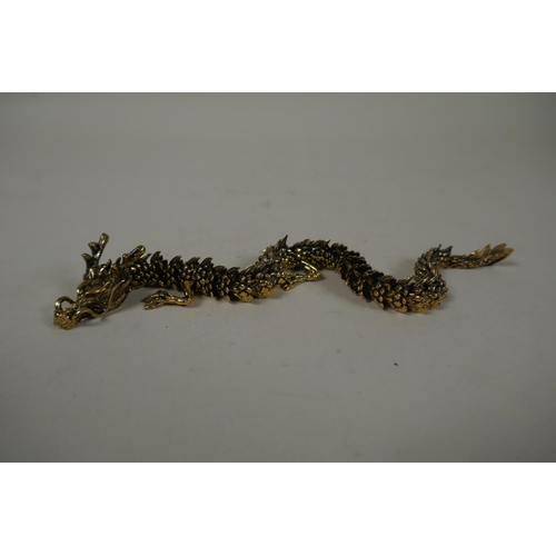 29 - A Japanese Jizai style articulated bronze okimono dragon, 22cm long