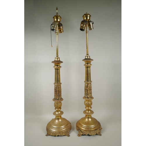 290 - A pair of Empire style gilt metal column table lamps, 85cm high