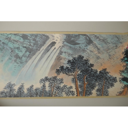 295 - A Chinese printed watercolour scroll depicting an extensive landscape scene, 34cm wide