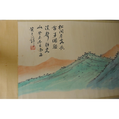 295 - A Chinese printed watercolour scroll depicting an extensive landscape scene, 34cm wide