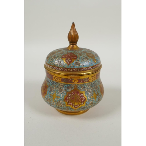 31 - An Islamic gilt brass and enamel sweet meat jar and cover, decorated with animals, figures and flowe... 