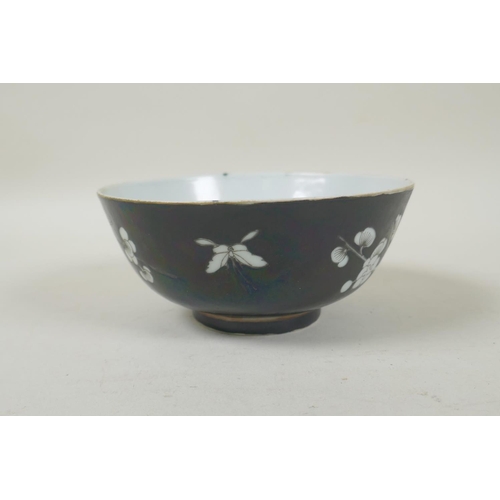 33 - A late C19th/early C20th Chinese famille noire porcelain rice bowl with prunus blossom decoration, Q... 