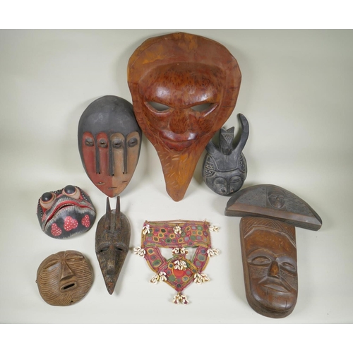 34 - A collection of tribal masks to include a Mali Marka mask, a Congolese Lega peoples mask, a Congoles... 