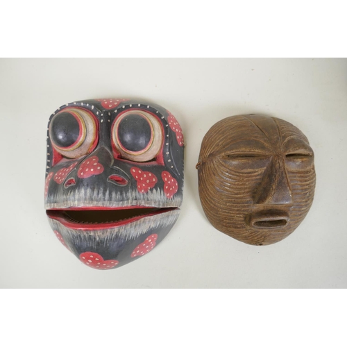 34 - A collection of tribal masks to include a Mali Marka mask, a Congolese Lega peoples mask, a Congoles... 