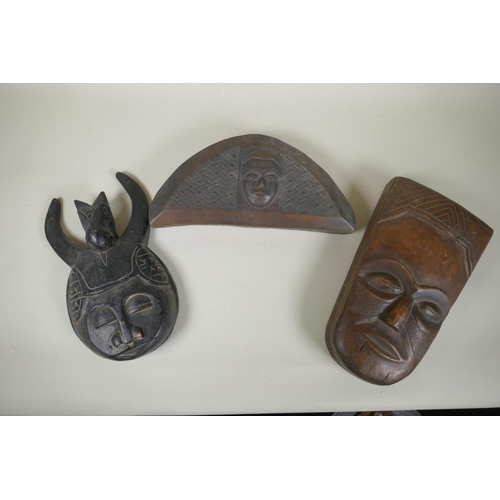 34 - A collection of tribal masks to include a Mali Marka mask, a Congolese Lega peoples mask, a Congoles... 