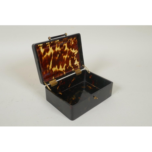 41 - An antique tortoiseshell box with cushion shaped cover, 11 x 7cm, 5cm high