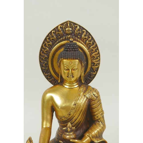 43 - A Sino Tibetan filled gilt bronze figure of Buddha, double vajra mark to base, and inscribed with Yo... 