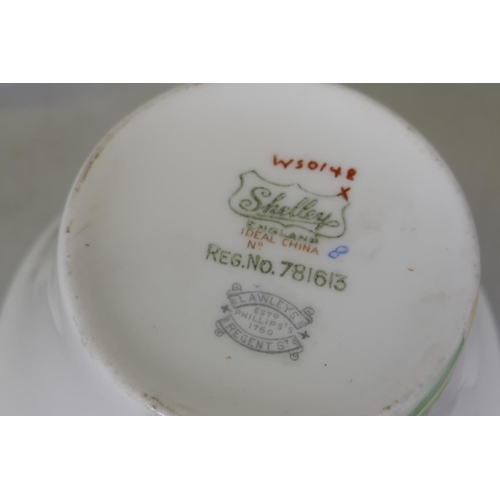 44 - A Shelley Regent shape pattern No. WS0148 six place tea set, stamped Lawley's Regent St, missing one... 