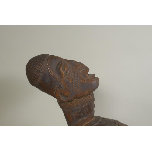 45 - An African early C20th Congolese carved wood Kundi harp with figural decoration, 68cm long