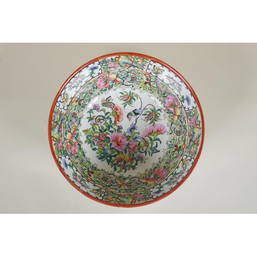 48 - A C19th Chinese Canton famille vert porcelain bowl decorated with birds and butterflies amongst flow... 