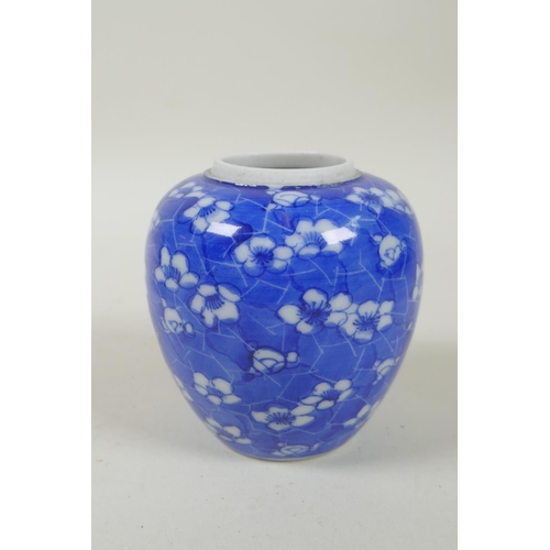 52 - A C19th Japanese Meiji period blue and white porcelain ginger jar decorated with prunus blossom on a... 