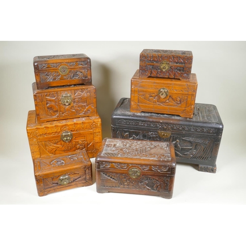 60 - Eight C19th/C20th Chinese carved camphor wood and hardwood trinket boxes decorated with figures in l... 