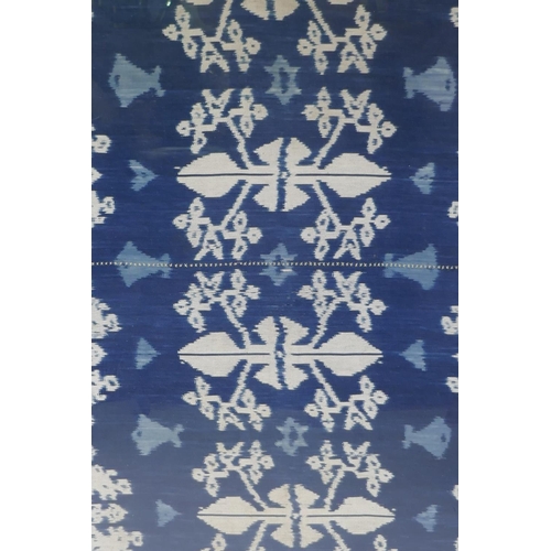 63 - An Indonesian Ikat textile wall hanging, framed, 96 x 118cm