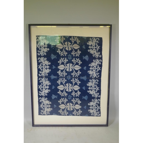 63 - An Indonesian Ikat textile wall hanging, framed, 96 x 118cm