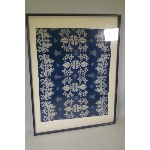 63 - An Indonesian Ikat textile wall hanging, framed, 96 x 118cm