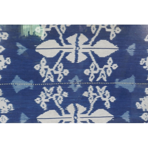 63 - An Indonesian Ikat textile wall hanging, framed, 96 x 118cm