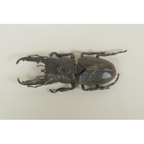 65 - A Japanese style bronze okimono stag beetle, 13cm long