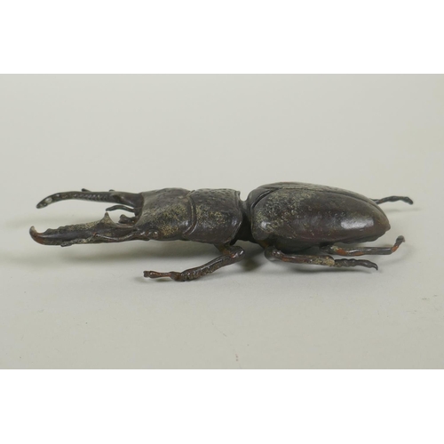 65 - A Japanese style bronze okimono stag beetle, 13cm long