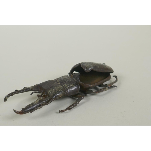 65 - A Japanese style bronze okimono stag beetle, 13cm long