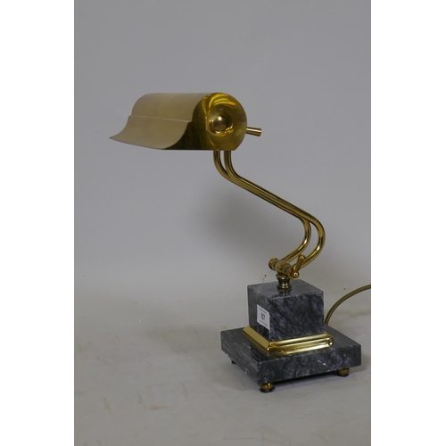 67 - A brass adjustable desk lamp, raised on a marble base, labelled Gibson Lighting, 23cm wide, 36cm hig... 